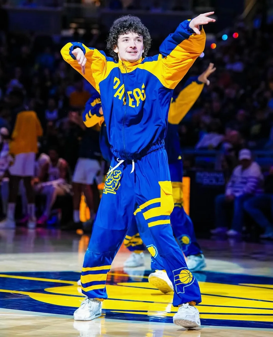 Ben Goodman performing on an NBA court in a Pacers warm-up suit